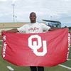 Adrian Peterson displaying OU Kwik-Cover